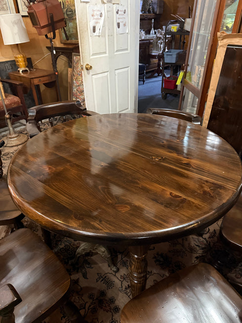 Round, dark wood dining table