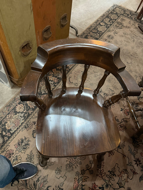 Round, dark wood dining table