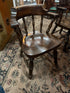 Round, dark wood dining table