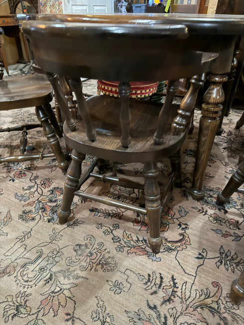 Round, dark wood dining table