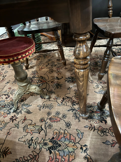 Round, dark wood dining table